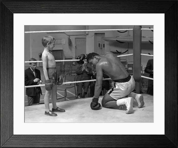 Framed Print : Cassius Clay with 6 year old Patrick Power in the ring during his training for