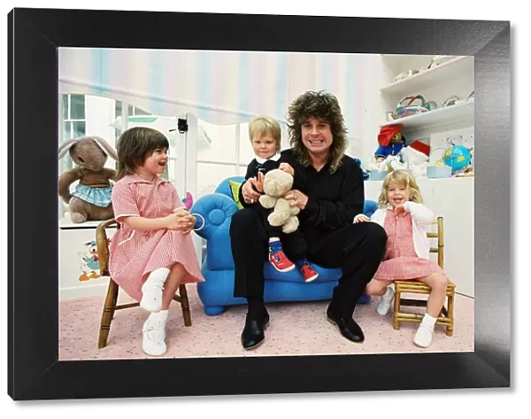 Ozzy Osbourne at home in 1988 with his children (l-r, Aimee