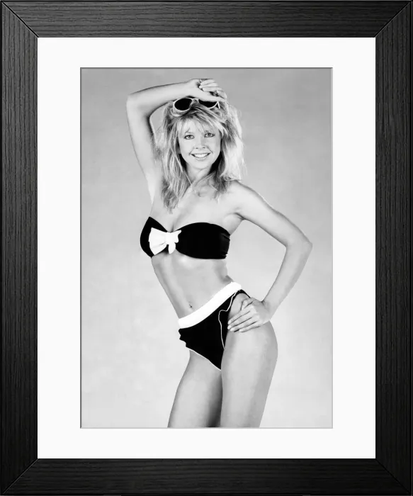 Framed Print : Clothing Beach. Sultry charm frilly knicker bikini with bow and a host of roll up