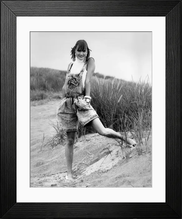 Framed Print : Fashion - Shorts: Baggy bib and braces shorts, polo neck T-shirt and white moccasins Framed Print : Fashion - Shorts: Baggy bib and braces shorts, polo neck T-shirt and white moccasins