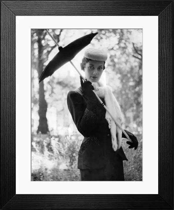 Framed Print : Norman Hartnell fashions. A woman holding a brolly in black velvet gloves
