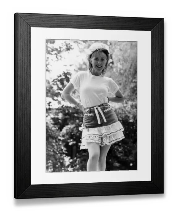 Framed Print : Fashion Skirt: Frilly Lulu in her t-shirt, hat and Acrobat rara skirt costing £32 Framed Print : Fashion Skirt: Frilly Lulu in her t-shirt, hat and Acrobat rara skirt costing £32