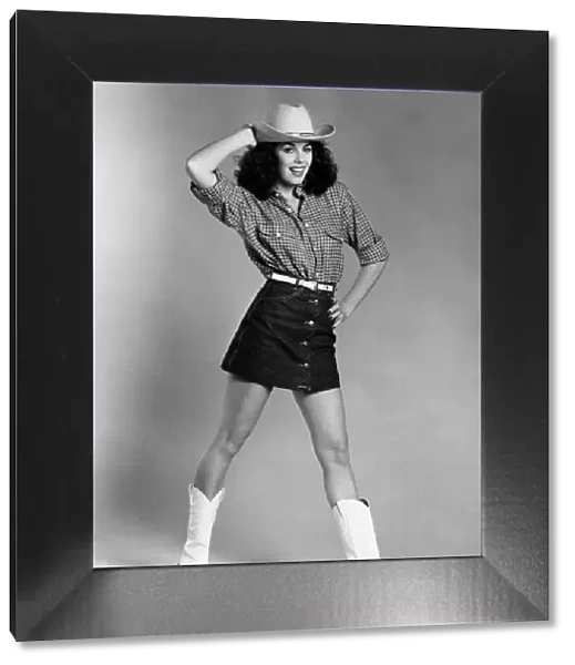 Fashion - Skirts. Model wears cowboy hat, checked shirt