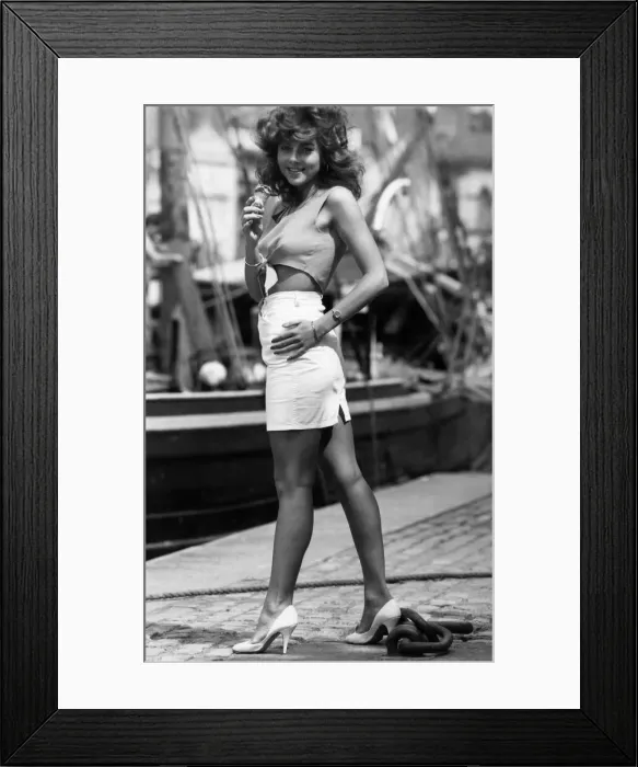 Framed Print : Fashion - Skirts: Shorty Model Marcia Murphy wears tied shirt and white skirt Framed Print : Fashion - Skirts: Shorty Model Marcia Murphy wears tied shirt and white skirt