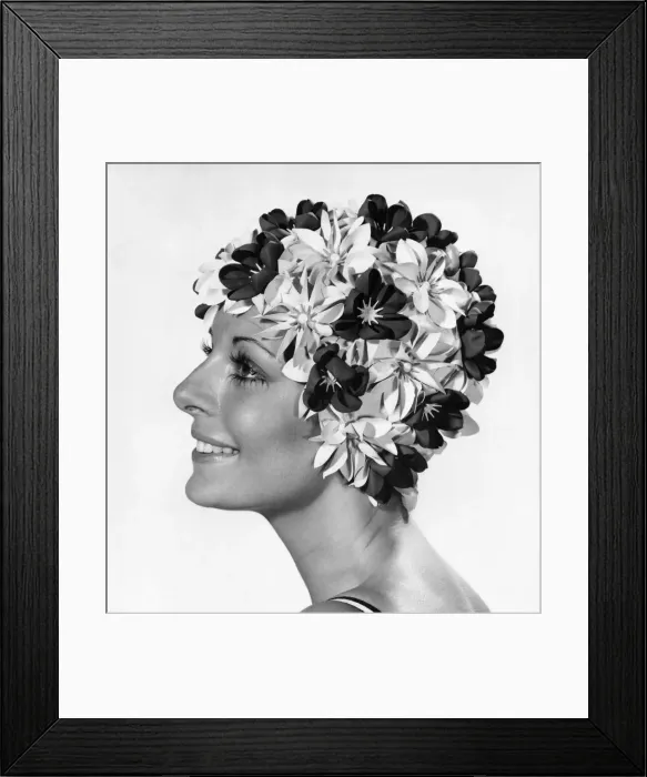 Framed Print : Clothing Beach. Woman models swimming hat covered in flowers