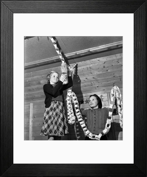Framed Print : Girls hanging up Christmas decorations in their cabin. Pestalozzi Children Framed Print : Girls hanging up Christmas decorations in their cabin. Pestalozzi Children