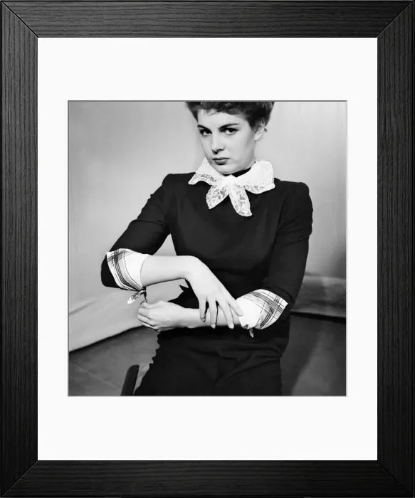 Framed Print : Woman poses wearing a neck scarf and handkerchiefs as cuffs Framed Print : Woman poses wearing a neck scarf and handkerchiefs as cuffs