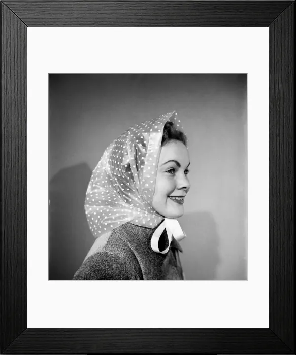 Framed Print : Woman poses wearing a long coat and head scarf. October 1952 C6273-002 Framed Print : Woman poses wearing a long coat and head scarf. October 1952 C6273-002