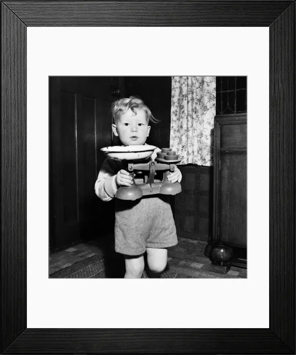 Framed Print : Young toddler boy holding pair of weighing scales December 1952 C6391-001 Framed Print : Young toddler boy holding pair of weighing scales December 1952 C6391-001