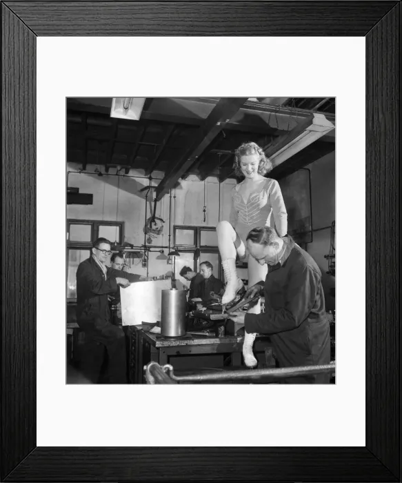 Framed Print : Skater Sheila Hamilton gets her skates put on for her performance in Framed Print : Skater Sheila Hamilton gets her skates put on for her performance in