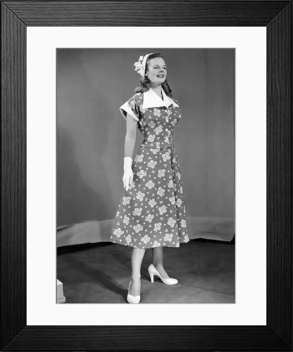 Framed Print : Clothes beach. Calf length dress with floral pattern and large collar Framed Print : Clothes beach. Calf length dress with floral pattern and large collar