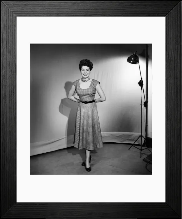 Framed Print : Woman wearing a pinafore dress November 1952 C6272-002 Framed Print : Woman wearing a pinafore dress November 1952 C6272-002