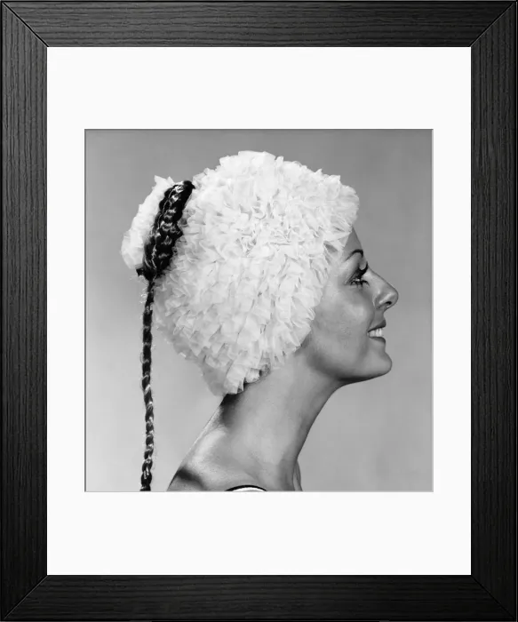 Framed Print : Clothing : Beach. Woman models a frilly swimming hat. October 1970 P017299 Framed Print : Clothing : Beach. Woman models a frilly swimming hat. October 1970 P017299
