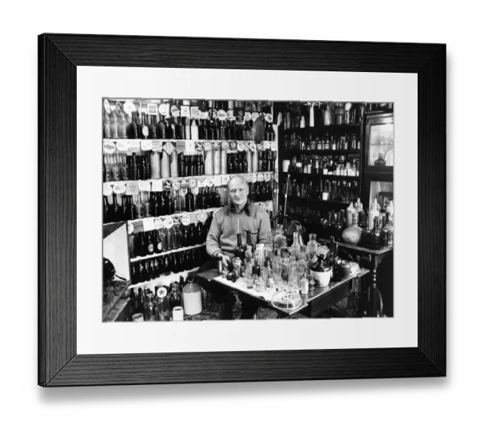 Framed Print : Arthur Rowland at his bottle business which is popular with collectors Framed Print : Arthur Rowland at his bottle business which is popular with collectors