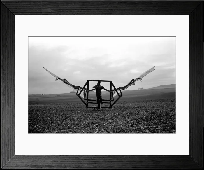 Framed Print : A man trues out his home made flying machine in a field in Wiltshire Framed Print : A man trues out his home made flying machine in a field in Wiltshire