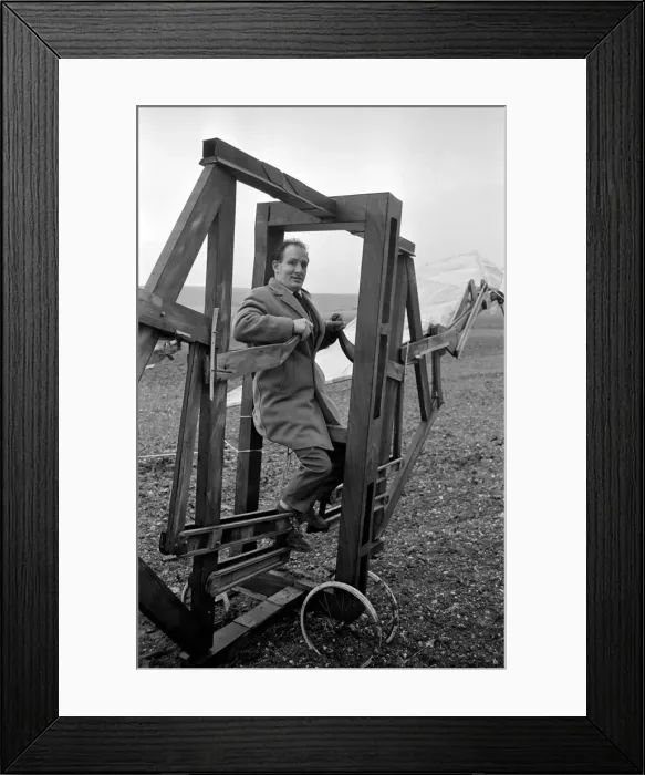 Framed Print : A man trues out his home made flying machine in a field in Wiltshire Framed Print : A man trues out his home made flying machine in a field in Wiltshire