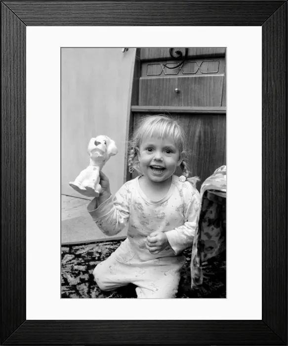 Framed Print : Three year old girl playing at home. November 1969 Z10847-003