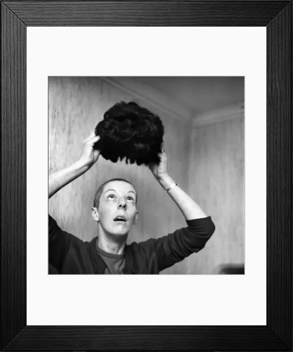 Framed Print : Woman with a bald head, with her wig. November 1969 Z11155-008