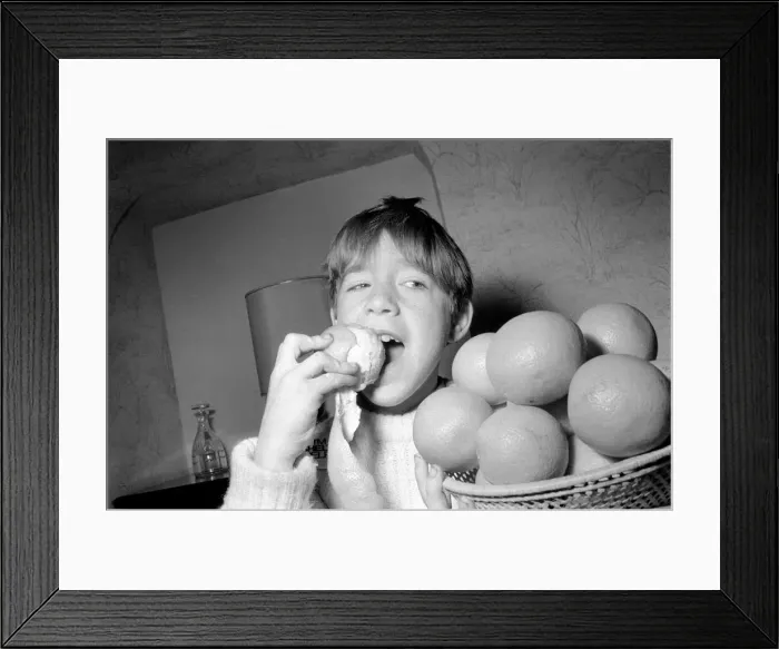 Framed Print : Matthew Ives, timed by his sister Sally, eating his way to a world record by consuming 12