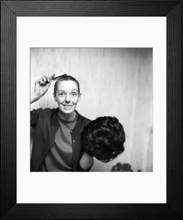 Framed Print : Woman with a bald head, with her wig. November 1969 Z11155-004