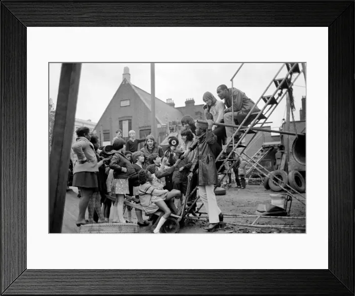 Framed Print : The Foundations pop group surrounded by children at the Notting Hill playground Framed Print : The Foundations pop group surrounded by children at the Notting Hill playground