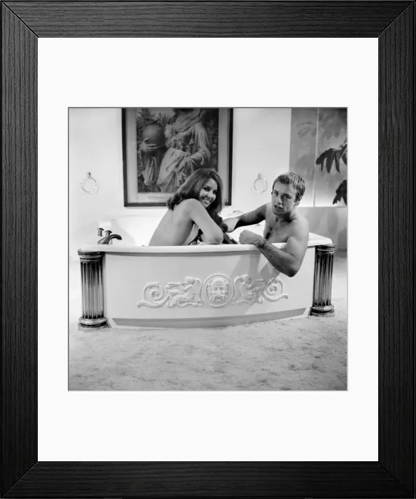 Framed Print : Man and woman sharing a bath designed for two. November 1969 Z10586-005