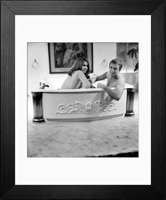Framed Print : Man and woman sharing a bath designed for two. November 1969 Z10586-007 Framed Print : Man and woman sharing a bath designed for two. November 1969 Z10586-007