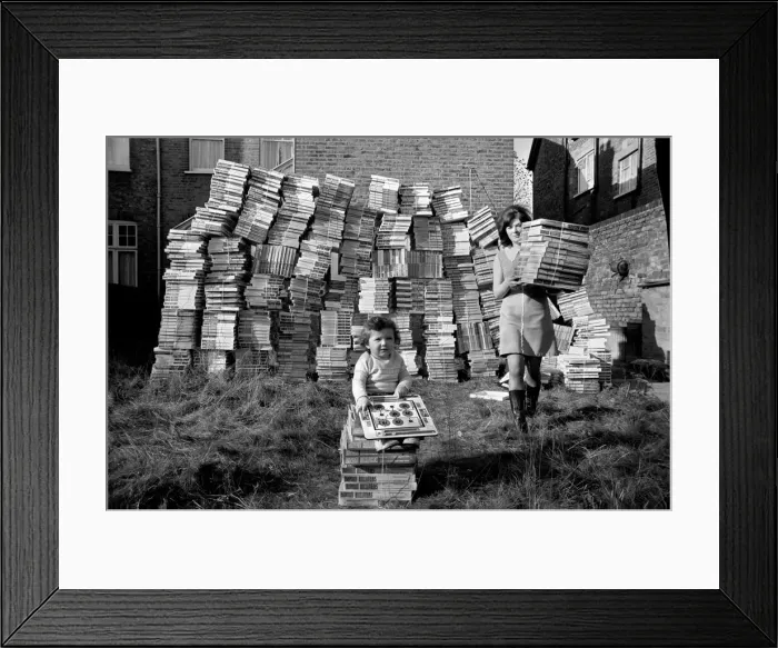 Framed Print : Santa Claus comes early for 14 month old Patrick Flood, as he plays with the dumped games Framed Print : Santa Claus comes early for 14 month old Patrick Flood, as he plays with the dumped games