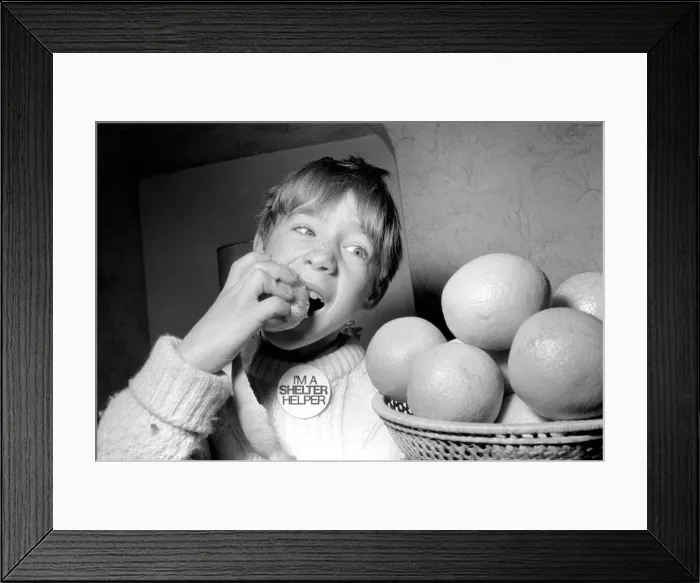 Framed Print : Matthew Ives, timed by his sister Sally, eating his way to a world record by consuming 12 Framed Print : Matthew Ives, timed by his sister Sally, eating his way to a world record by consuming 12