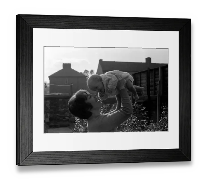 Framed Print : Eight month old baby girl pictured at home with her mother