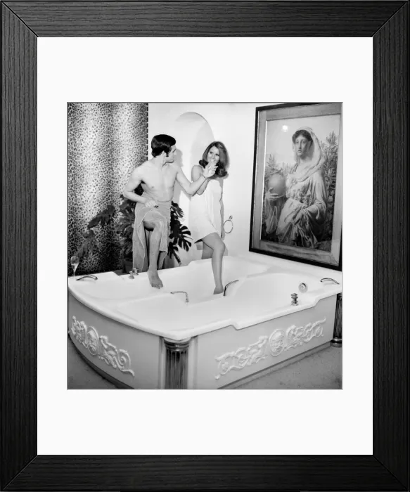 Framed Print : Man and woman sharing a bath designed for two. November 1969 Z10586 Framed Print : Man and woman sharing a bath designed for two. November 1969 Z10586