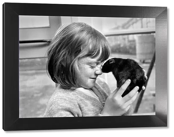 Little girl holding a rat. November 1969 Z10521