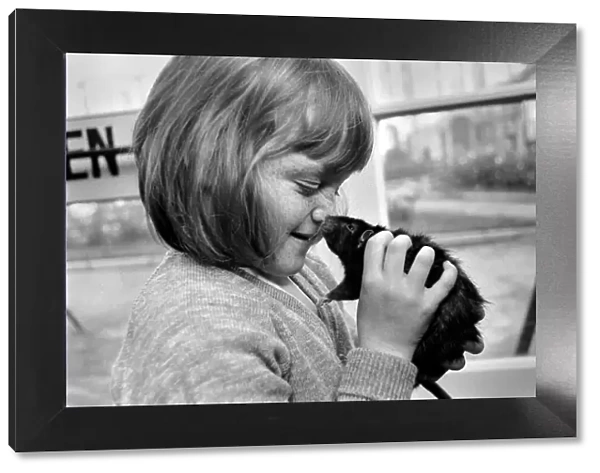 Little girl holding a rat. November 1969 Z10521-001