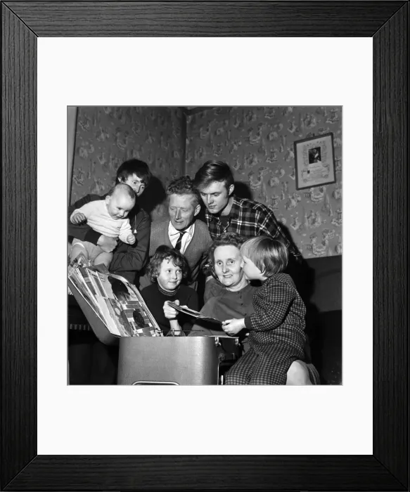 Framed Print : Pulling out vinyl records at her Acton Terrace home in Wigan is Mrs Framed Print : Pulling out vinyl records at her Acton Terrace home in Wigan is Mrs