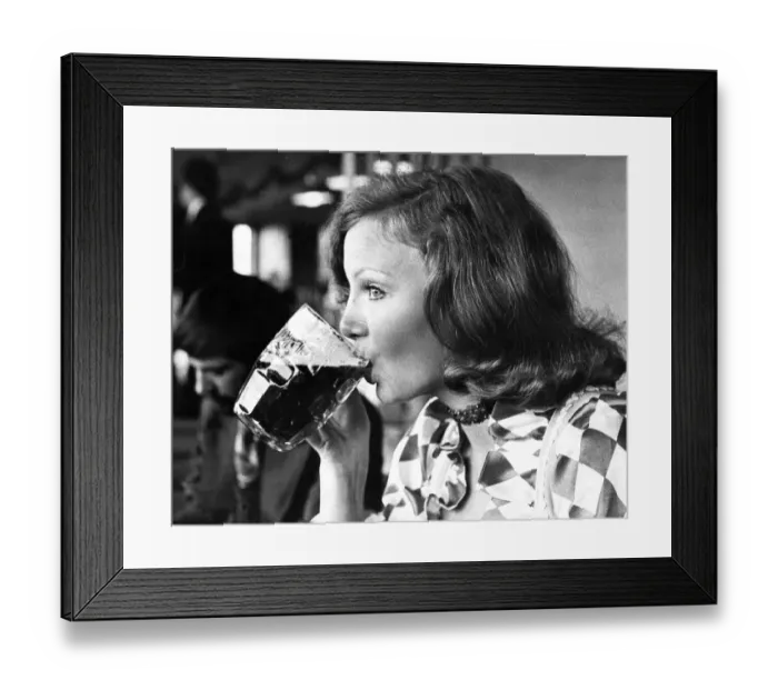 Framed Print : A woman drinking a pint of beer Framed Print : A woman drinking a pint of beer