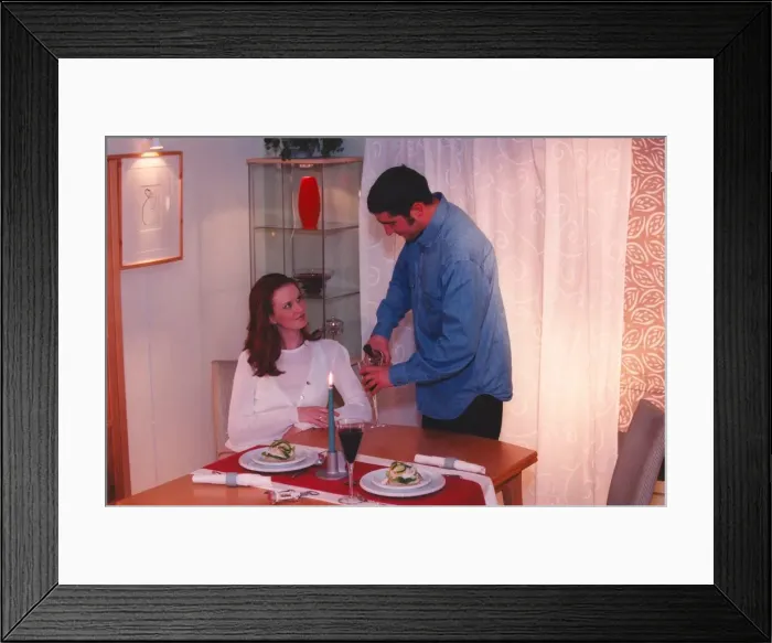 Framed Print : A couple enjoy a romantic candlelit dinner at home Framed Print : A couple enjoy a romantic candlelit dinner at home