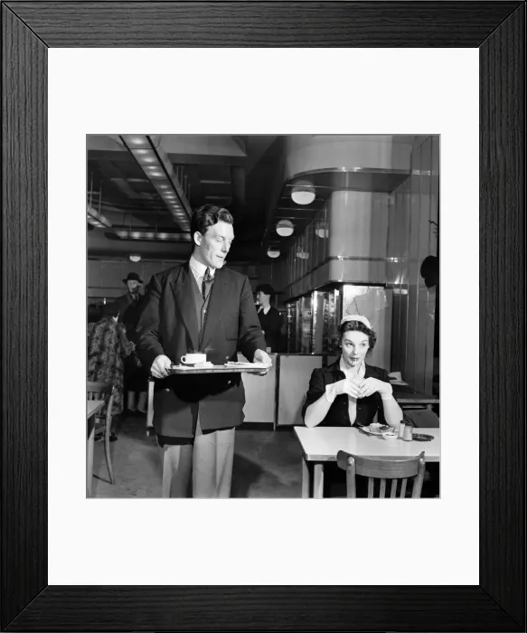 Framed Print : Shy boy and girl sitting together to have lunch in a canteen Framed Print : Shy boy and girl sitting together to have lunch in a canteen