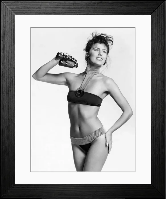Framed Print : Fashion - Beachwear: Back to the future fashions. Bikini tops will be making a big Framed Print : Fashion - Beachwear: Back to the future fashions. Bikini tops will be making a big