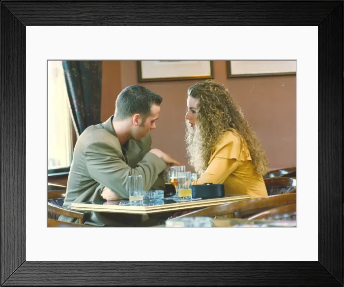 Framed Print : A couple enjoying a night out in a bar pub Framed Print : A couple enjoying a night out in a bar pub