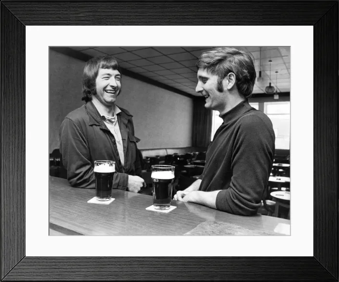 Framed Print : Two men have a pint of beer and a gossip at the bar Framed Print : Two men have a pint of beer and a gossip at the bar