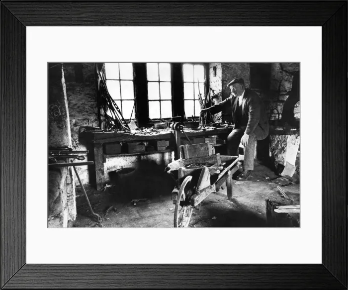 Framed Print : Retired blacksmith Tom Armstrong looks over the empty smithy at Matfen wondering if Framed Print : Retired blacksmith Tom Armstrong looks over the empty smithy at Matfen wondering if