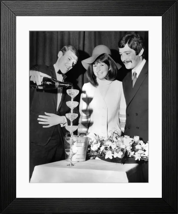 Framed Print : Derek Bower, wine waiter at the Moulin Rouge pours six champagne glasses at once