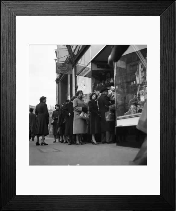 Framed Print : People queuing up outside a confectioney shop after sweets came off the ration following