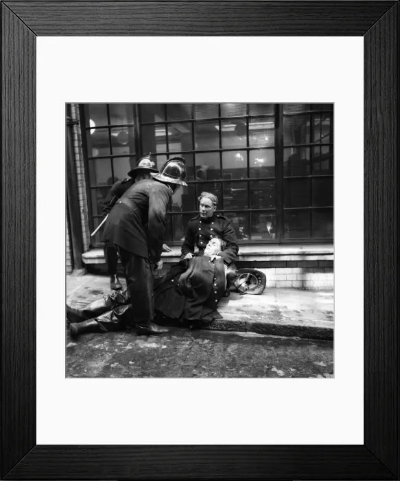 Framed Print : Emergency Services: Five service fireman R. Dastnell is revived by colleagues after fumes