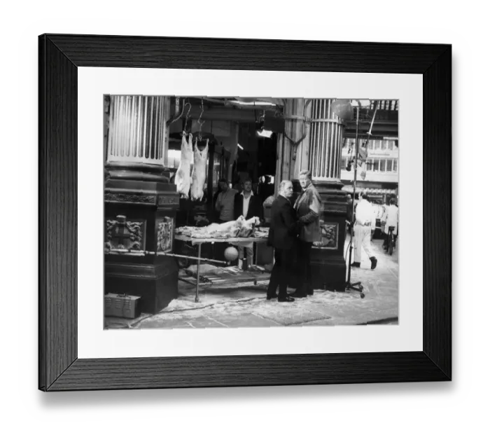 Framed Print : Filming scenes for their new movie, Brannigan. John Wayne (right