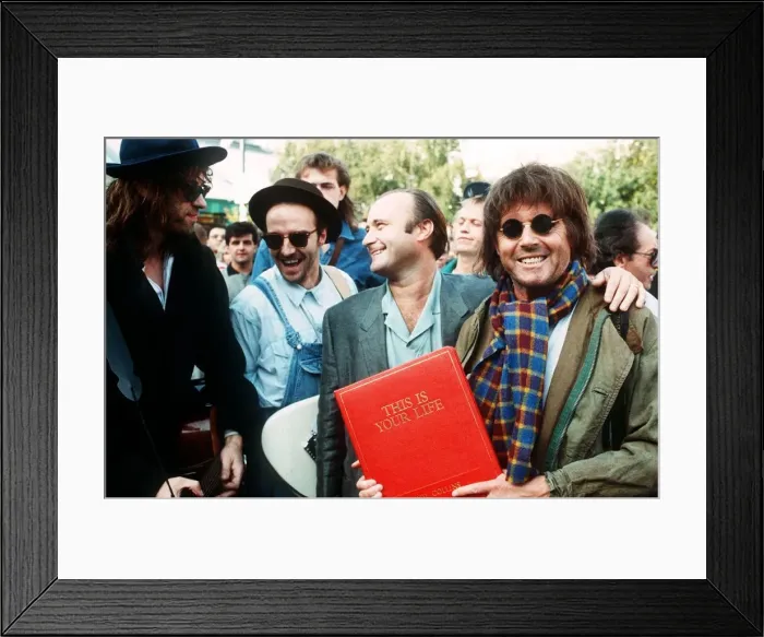 Framed Print : Michael Aspel TV Presenter surprises Phil Collins for the show This is your Life with
