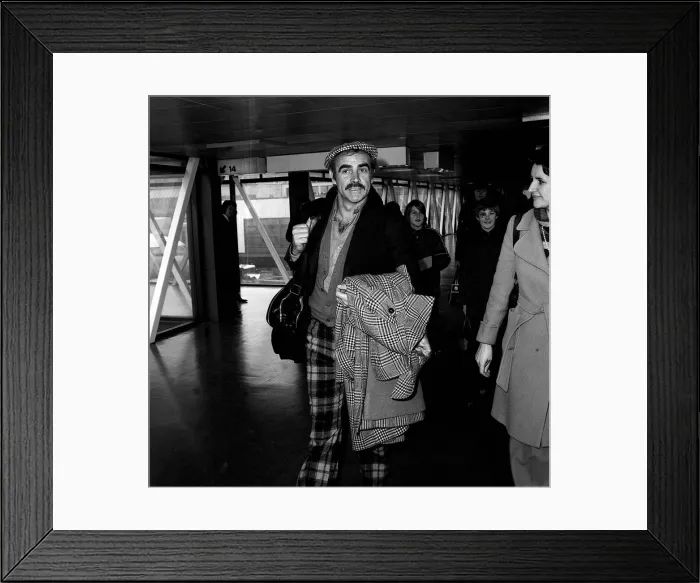 Framed Print : Sean Connery leaving Heathrow airport for Oslo where he is to play the part of an airport
