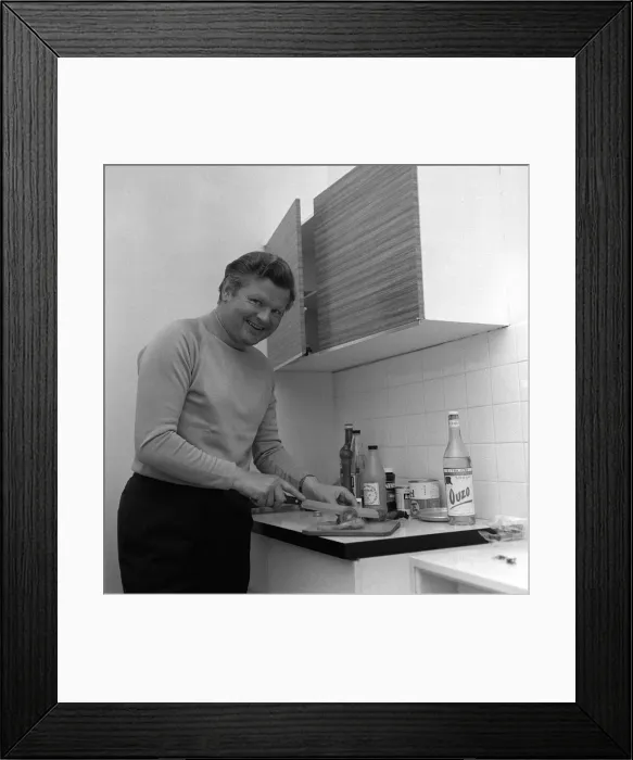 Framed Print : Comedian Benny Hill in his flat in the kitchen May 1969 Framed Print : Comedian Benny Hill in his flat in the kitchen May 1969