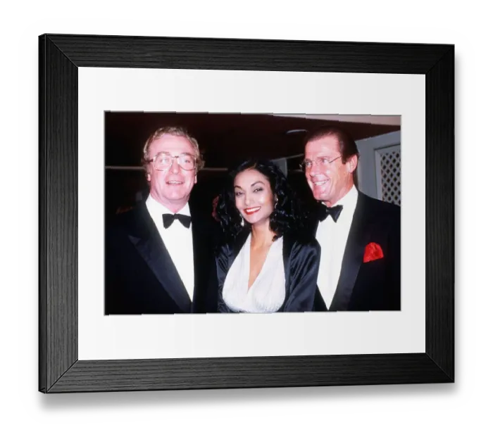 Framed Print : Michael Caine with wife Shakira and Roger Moore at the Barnardos ball at the Grosvenor