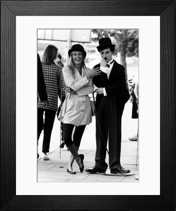 Framed Print : Twiggy Model with man dressed up as Charlie Chaplin